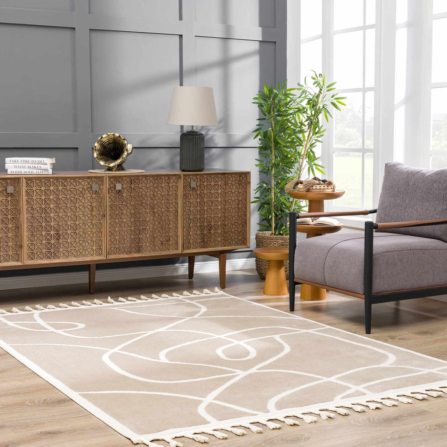 Taupe line art rug with fringe in a living room