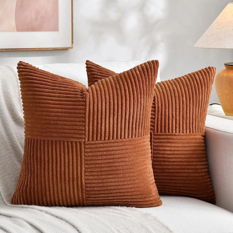 Rust corduroy pillow covers on a sofa