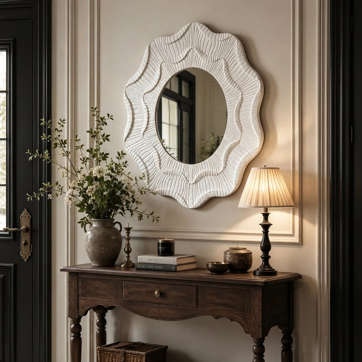 Wavy flower wall mirror in an entryway with a console table