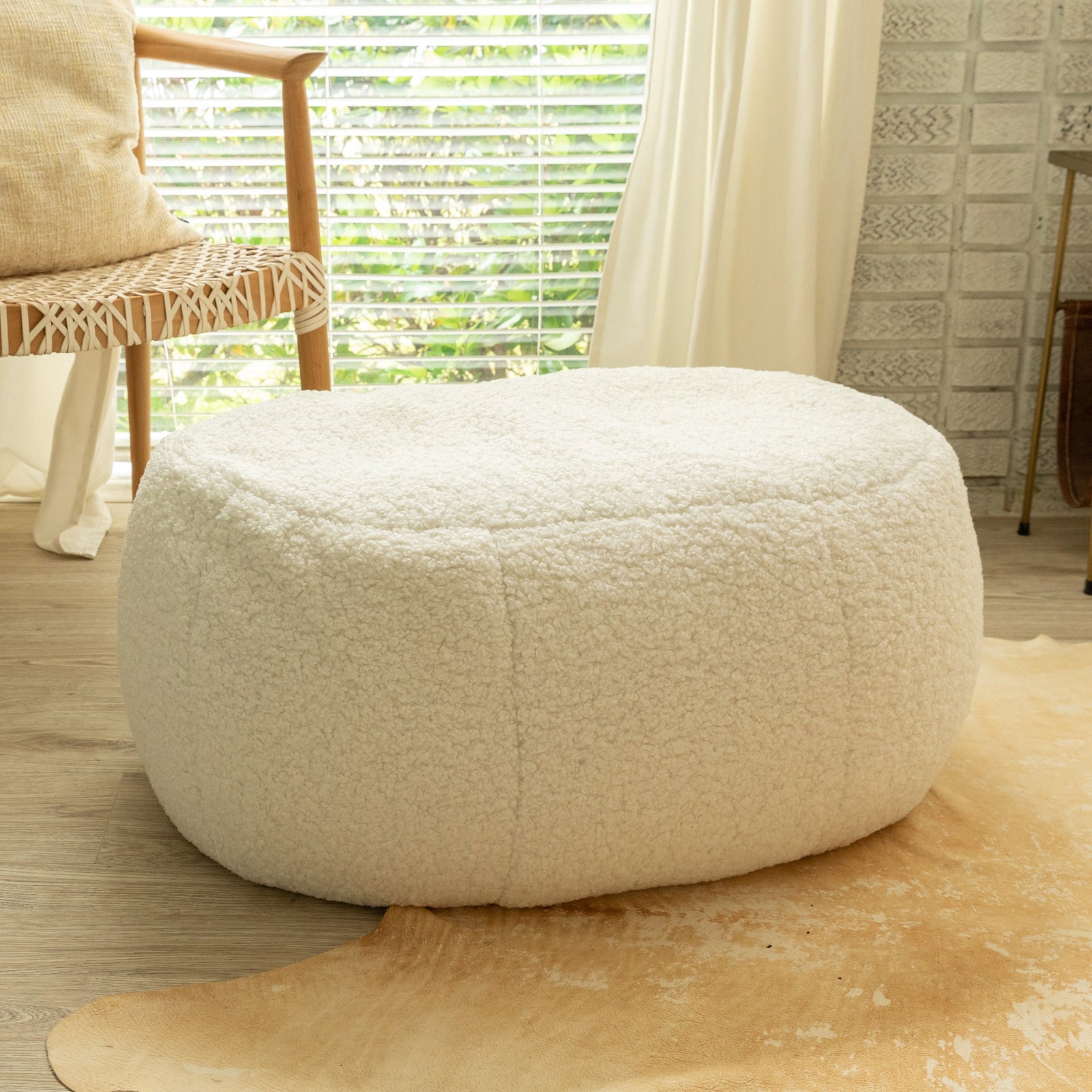 Ellis Ottoman large in white sherpa in sunroom