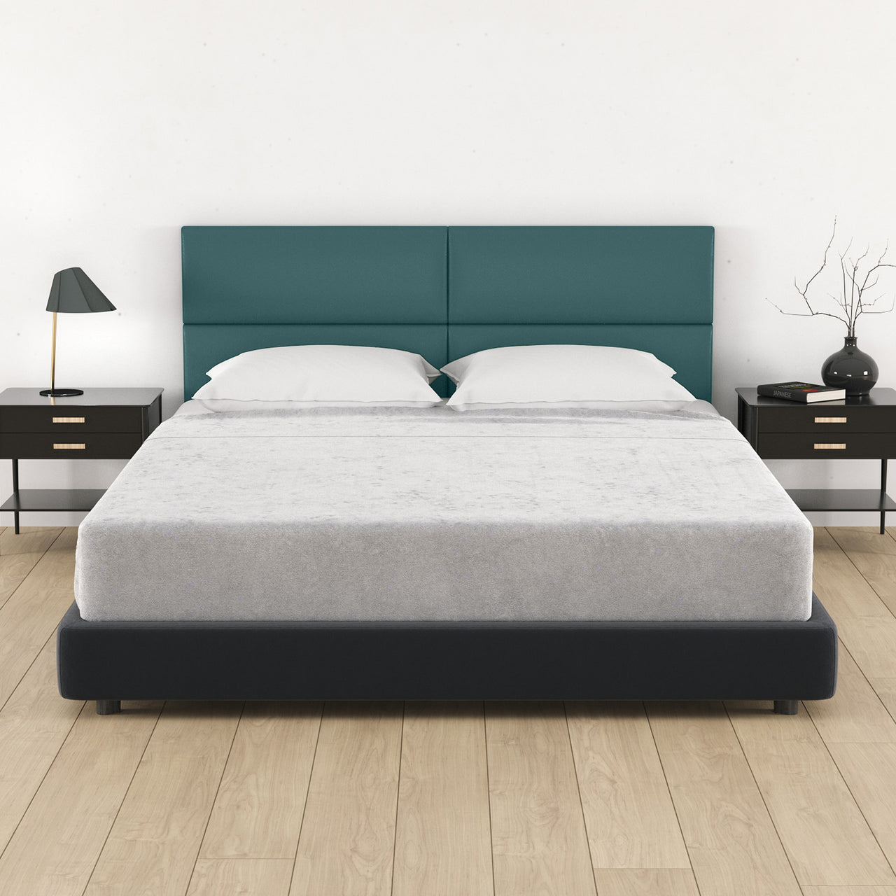 Bed with teal headboard and white bedding in a bedroom setting