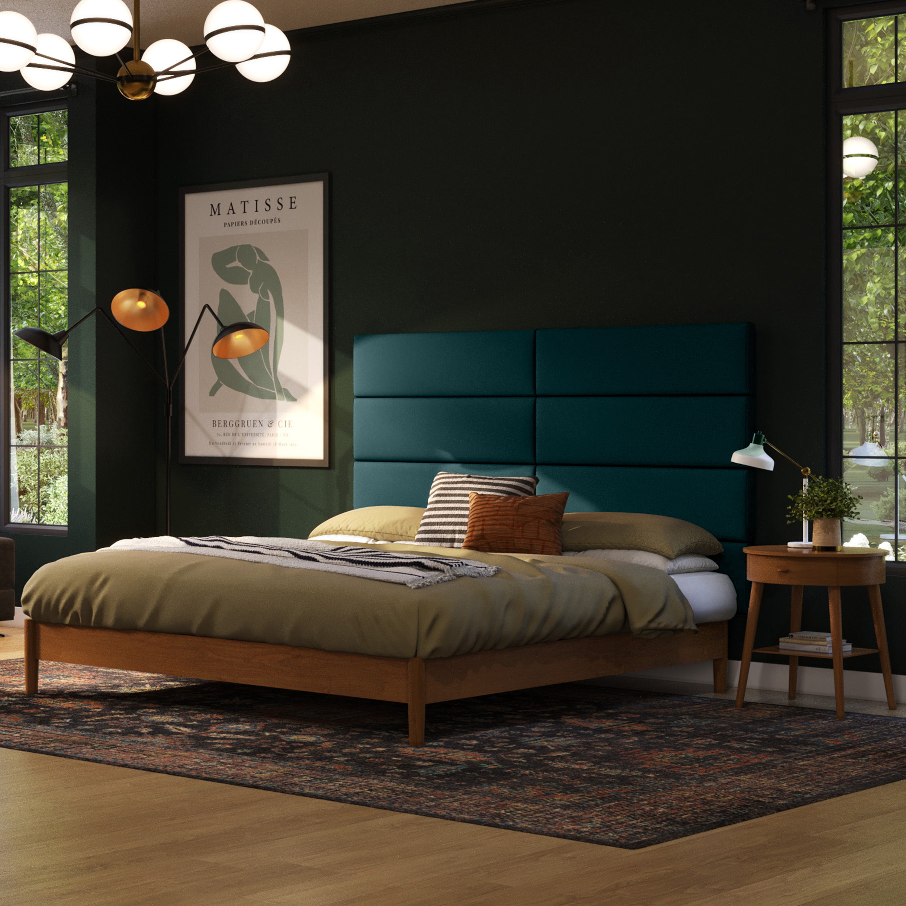 Modern bedroom with a teal headboard and wooden bed frame.
