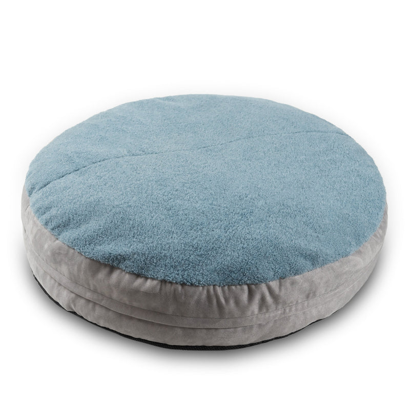 Round pet bed with blue top and gray bottom on a white background
