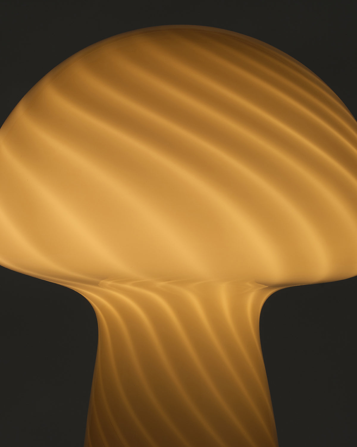 Mushroom Table Lamp, close up of the lit swirl glass