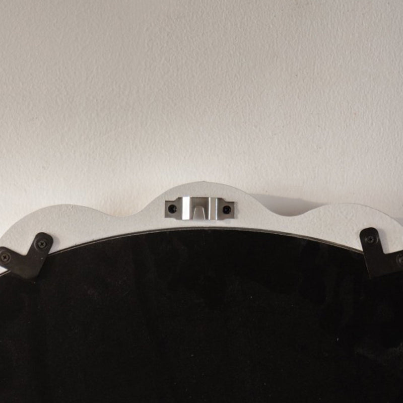 Back of the scalloped mirror with hanging hardware