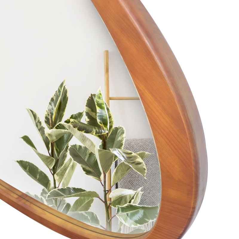 Detail of the curved wood frame reflecting a plant