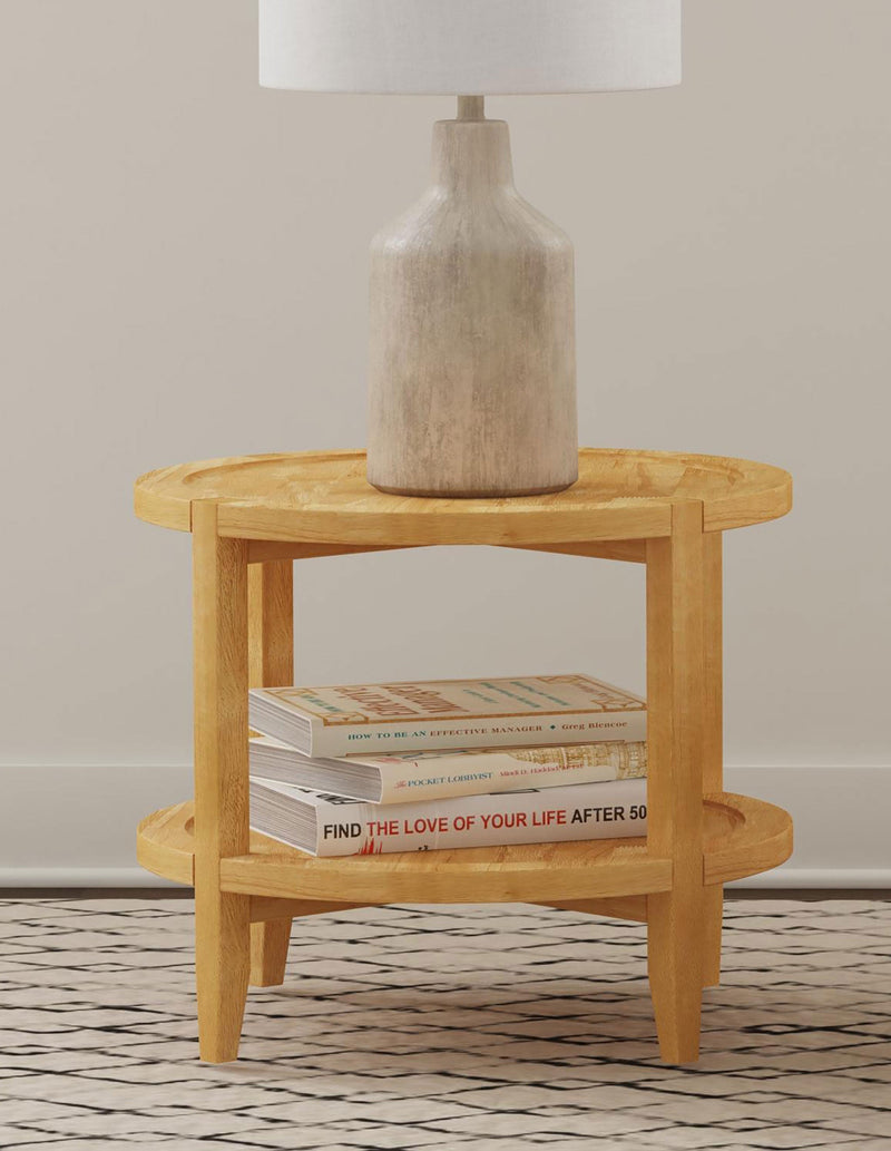 Camillo end table with a lamp on top and books on the lower shelf