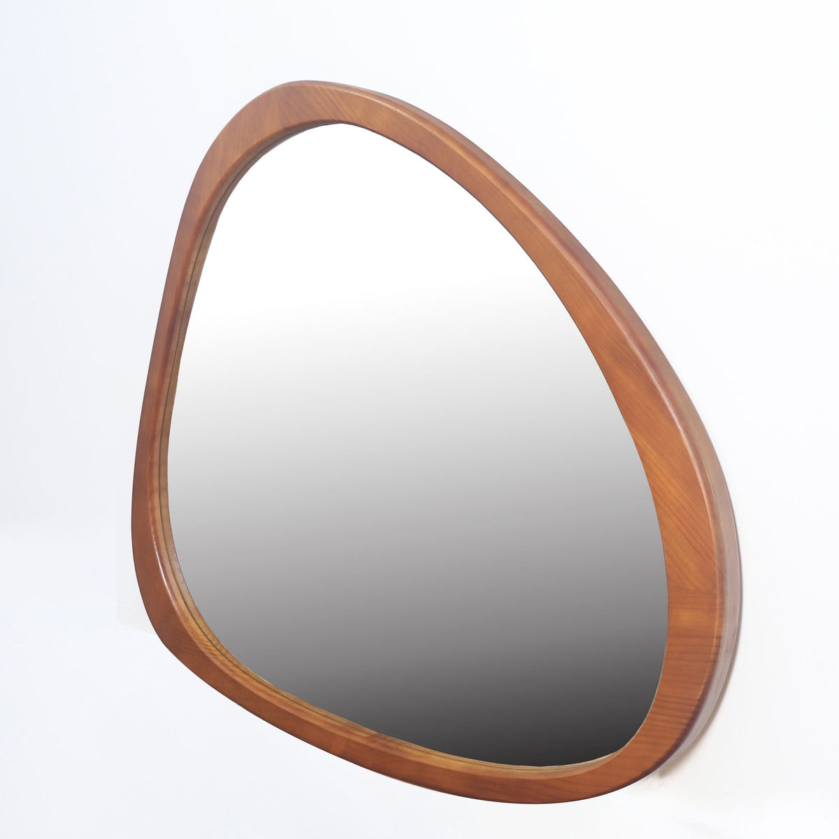 Asymmetrical wood wall mirror, angled view