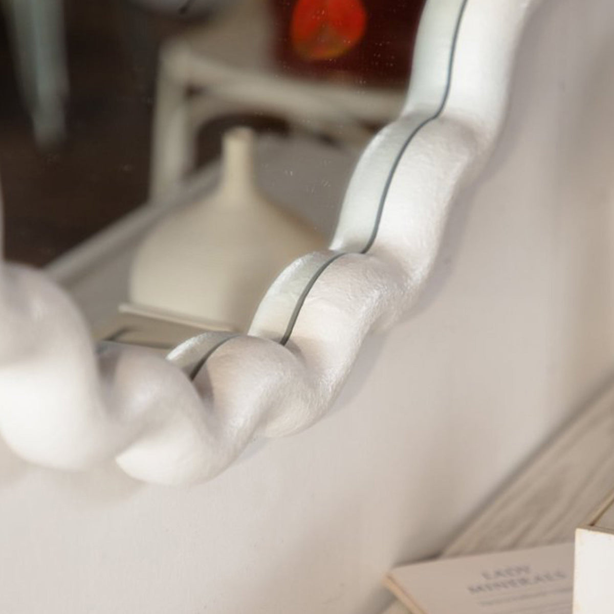 Detail of the wavy white frame