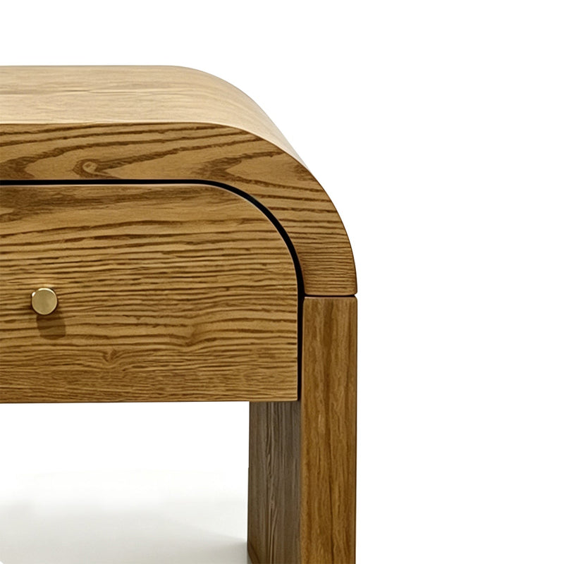 Curved Side Table with Drawer, close up of the curved top and gold knob