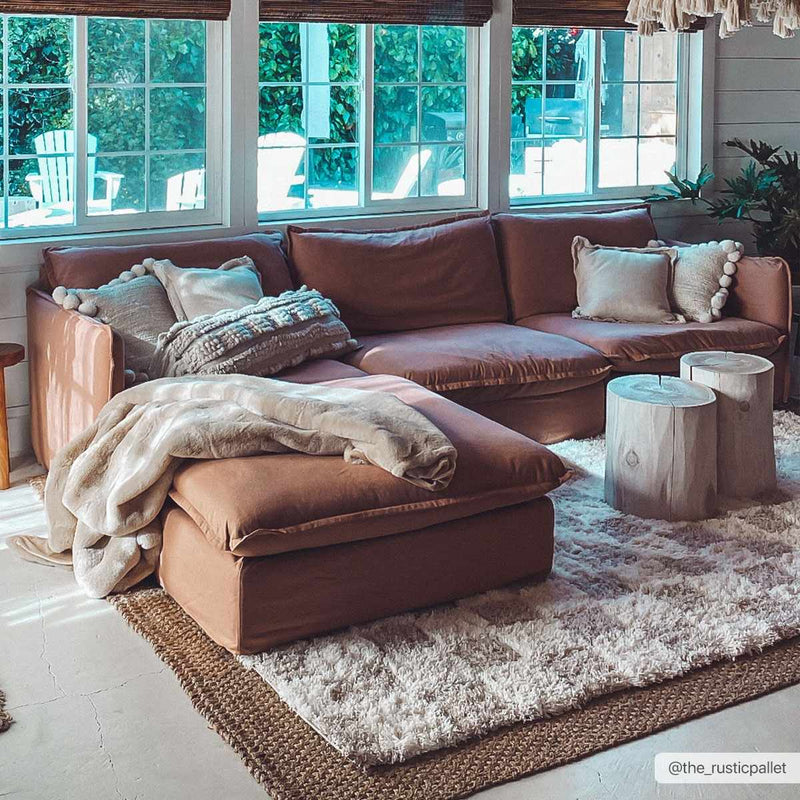 Checkered shag rug under a sectional sofa