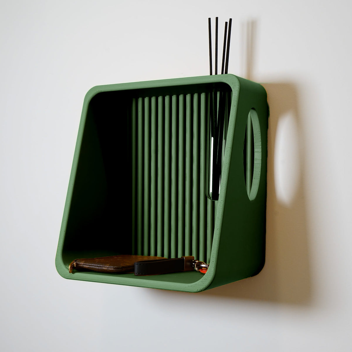 Ribbed Wall Shelf in green with reeds