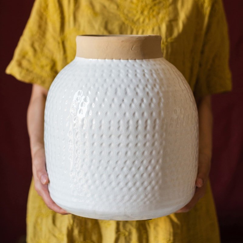 White Glazed Ceramic Vase held to show its size