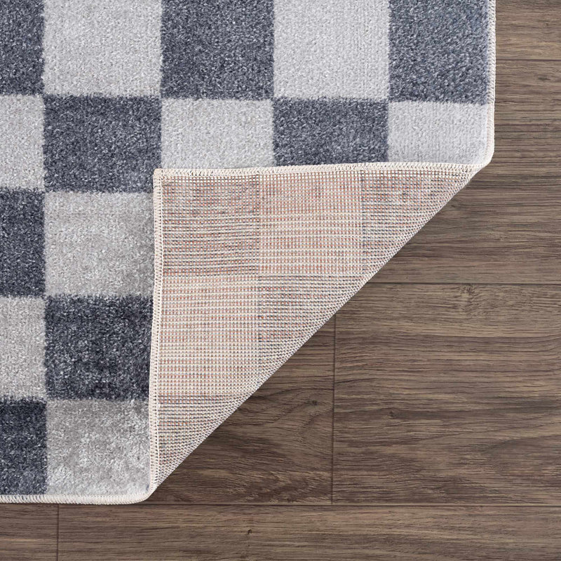 Alie rug corner folded to show the backing
