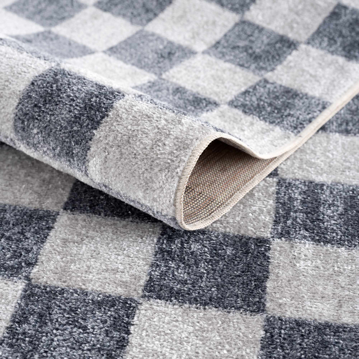 Alie rug folded to show the checkered pattern