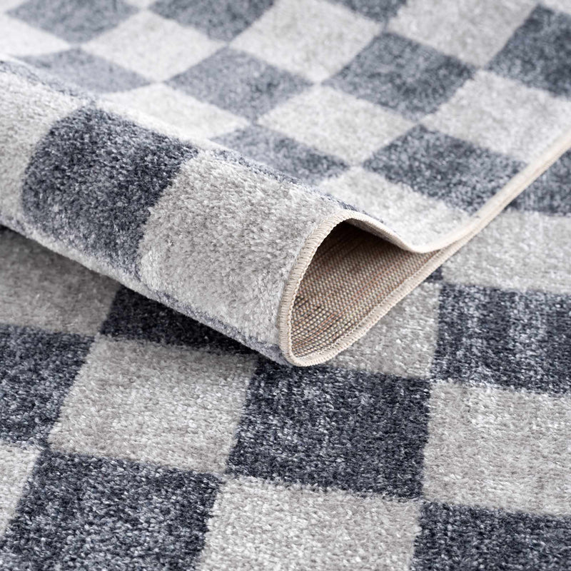 Alie rug folded to show the checkered pattern