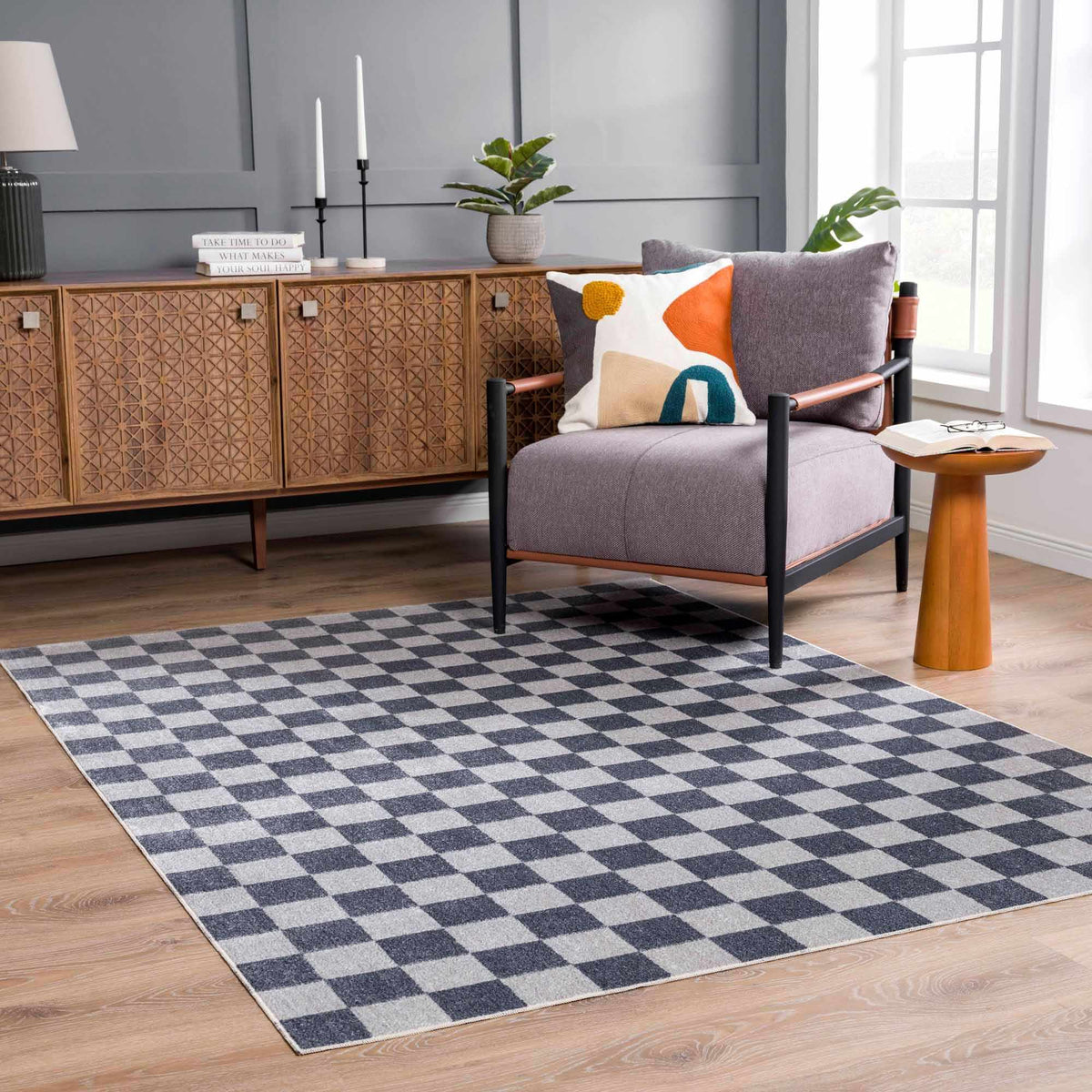 Alie checkered rug under a sofa