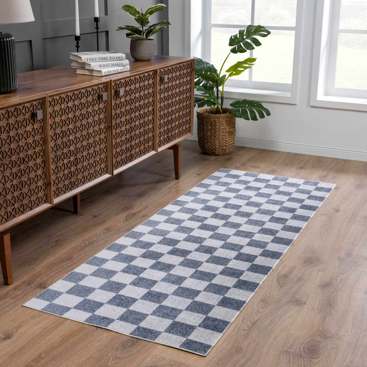 Alie checkered rug in front of a sideboard