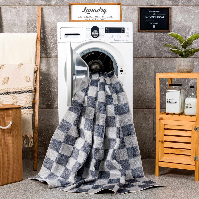 Alie washable rug going into a washing machine