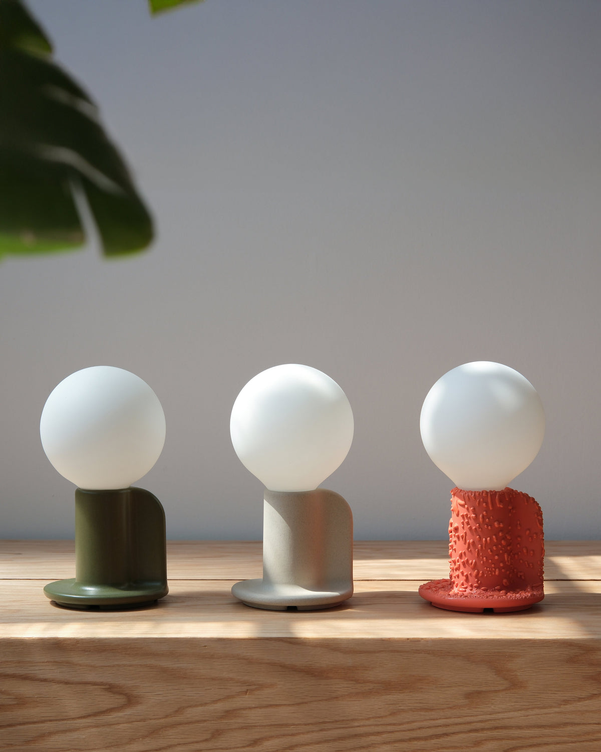 Three Q Lamps in white, gray and terracotta
