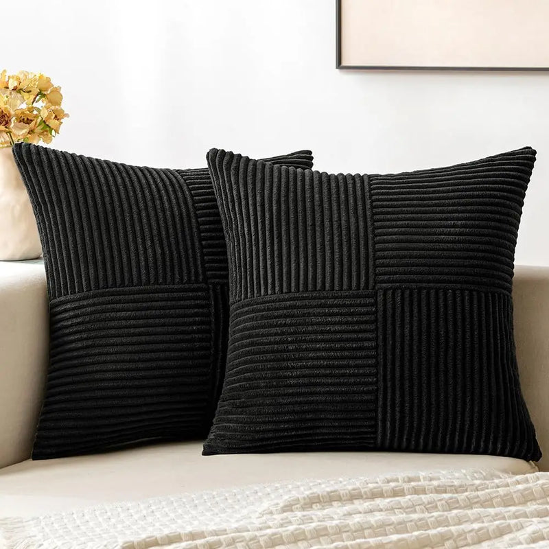 Black corduroy pillow covers on a sofa