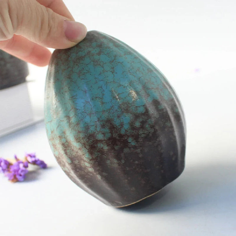 Wabi-Sabi Ceramic Bud Vase, teal glaze shape E held in hand
