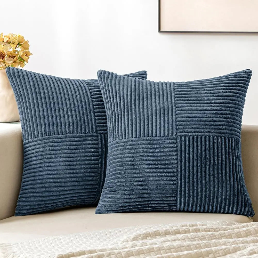Blue corduroy pillow covers on a sofa
