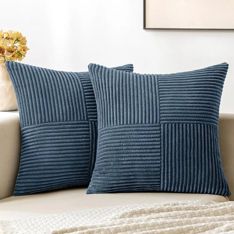 Blue corduroy pillow covers on a sofa
