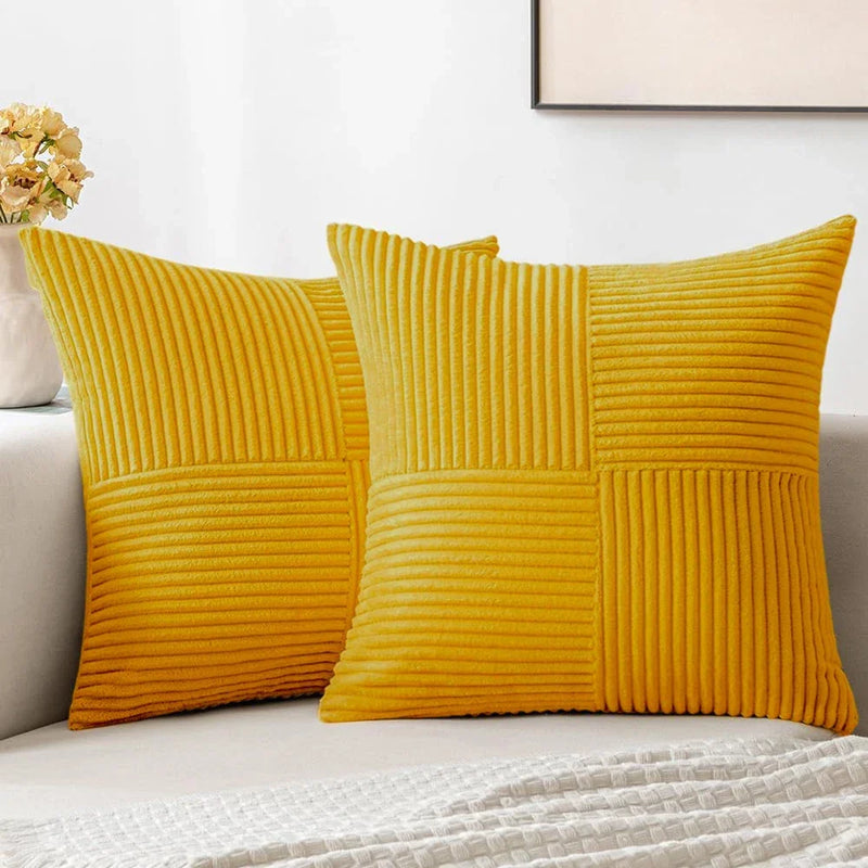Yellow corduroy pillow covers on a sofa