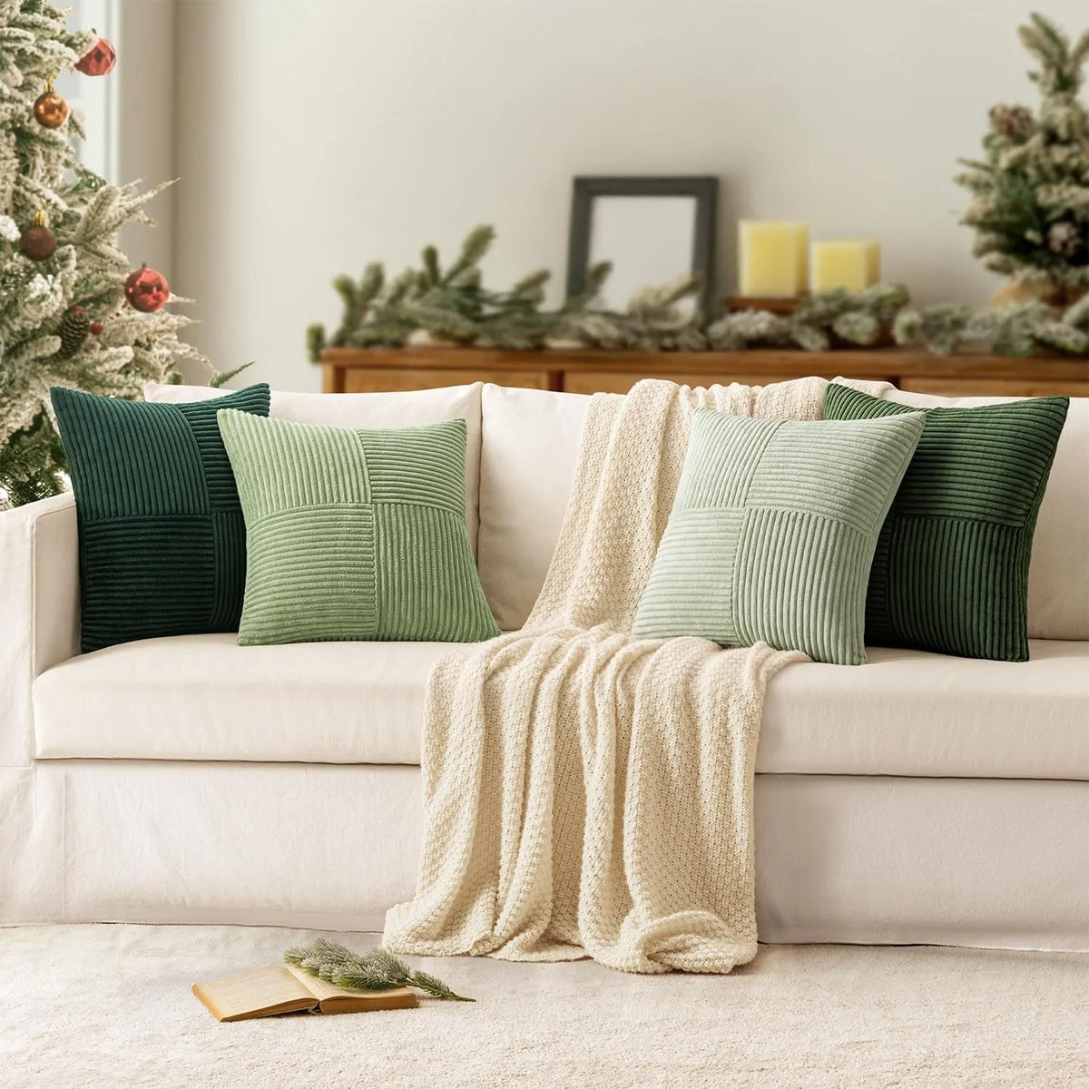 Green corduroy pillow covers styled on a cream sofa