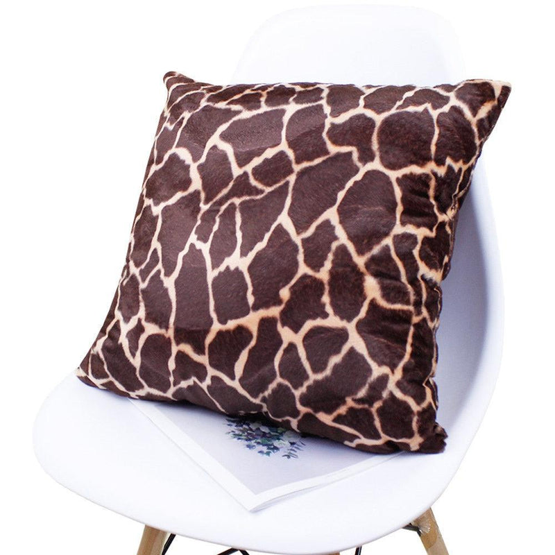 Plush giraffe print pillow cover on a chair