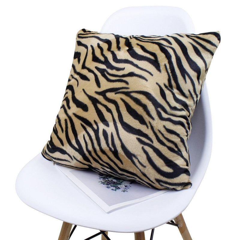 Plush tiger stripe pillow cover on a chair