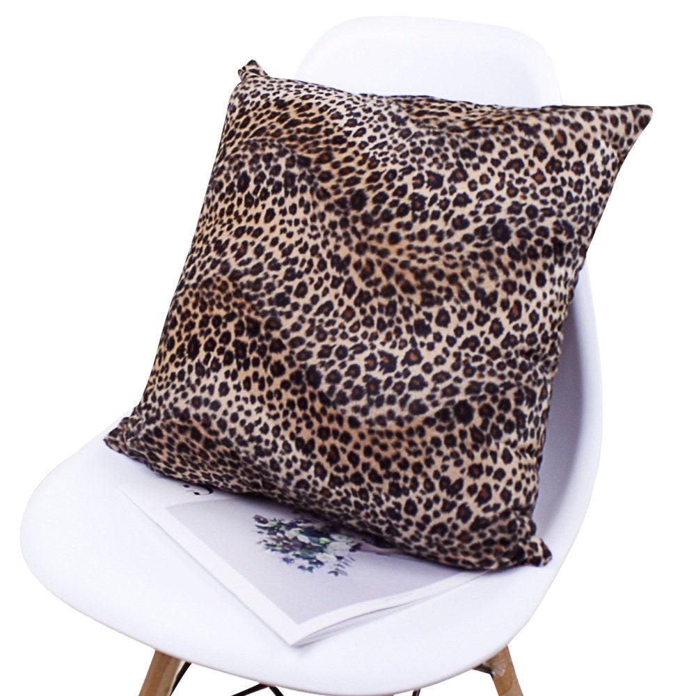 Plush leopard print pillow cover on a chair