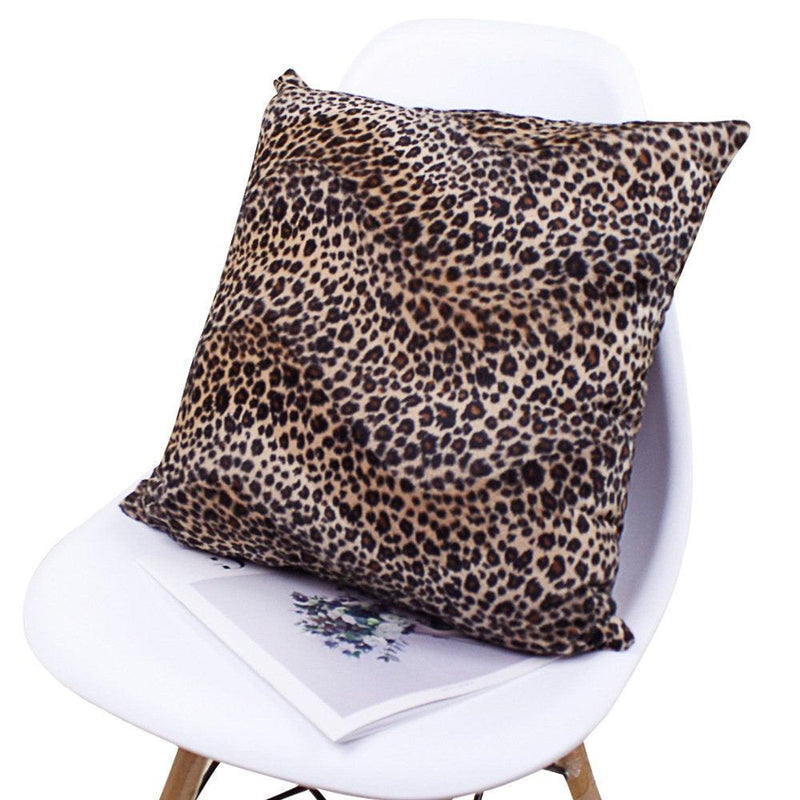 Plush leopard print pillow cover on a chair