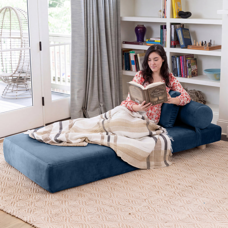 Avida Chair in Indigo Microvelvet, unfolded for reading and lounging