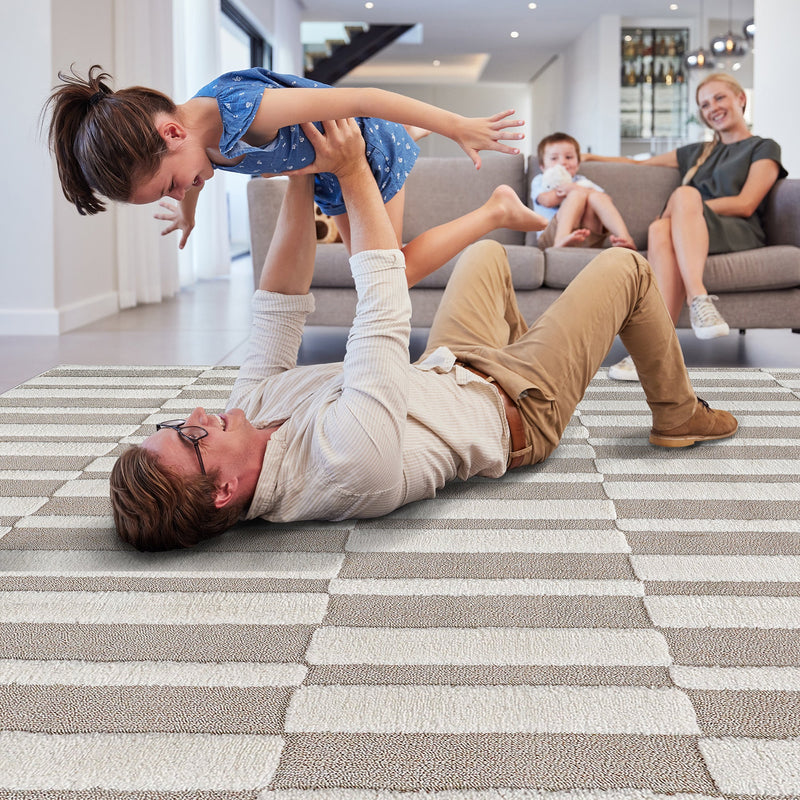 Family playing on the beige striped rug