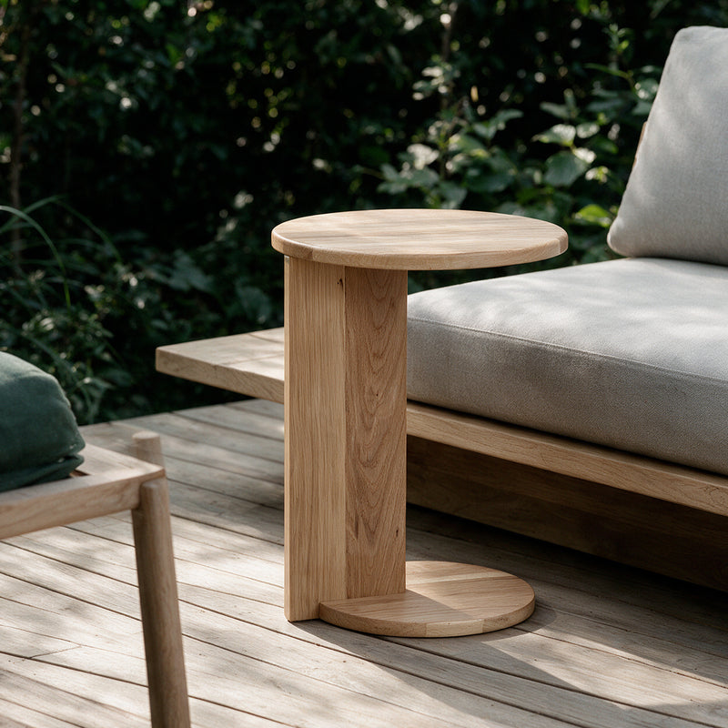 Natural Echo Side Table beside an outdoor lounge chair