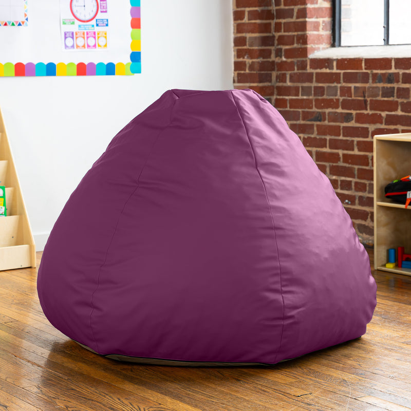 Purple bean bag chair in a room with a brick wall and colorful decorations.