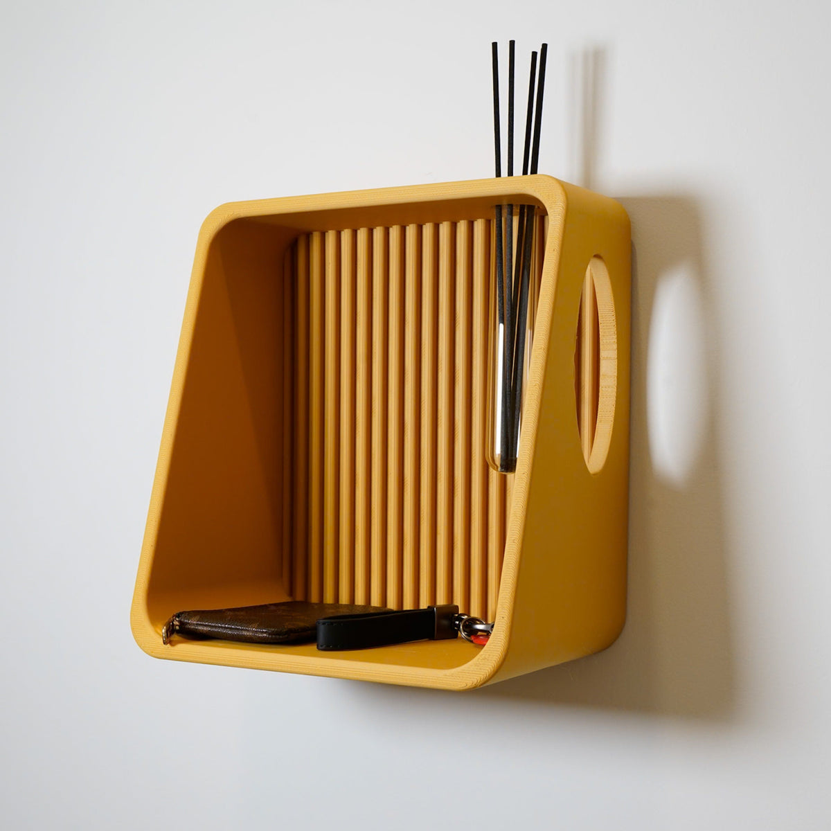 Ribbed Wall Shelf in mustard with reeds