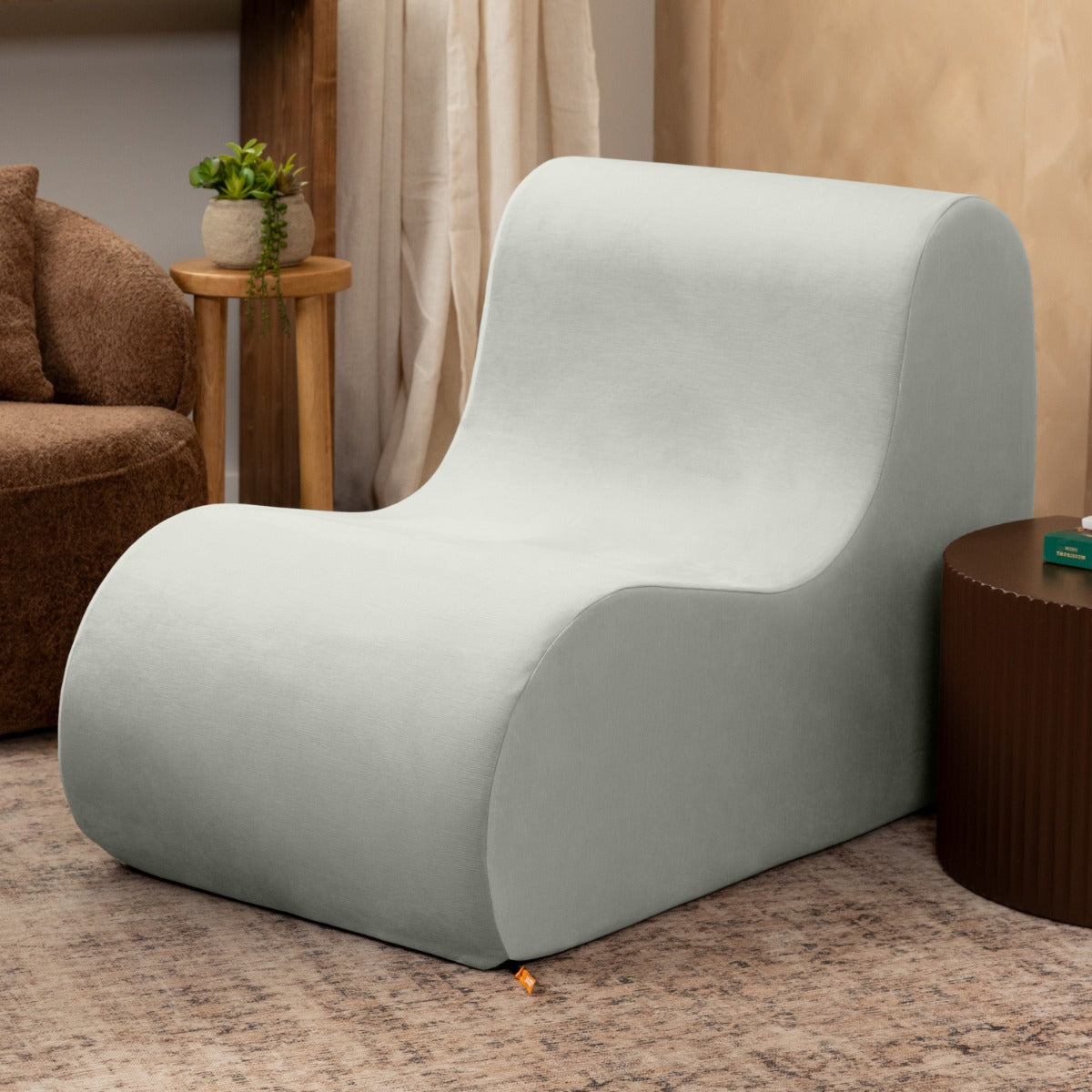 Uptown West Chair - Empire III Ice sitting in a living room