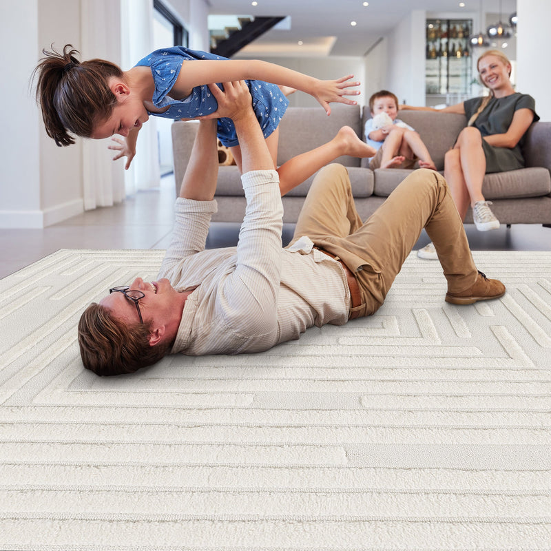 Family playing on the cream geometric rug