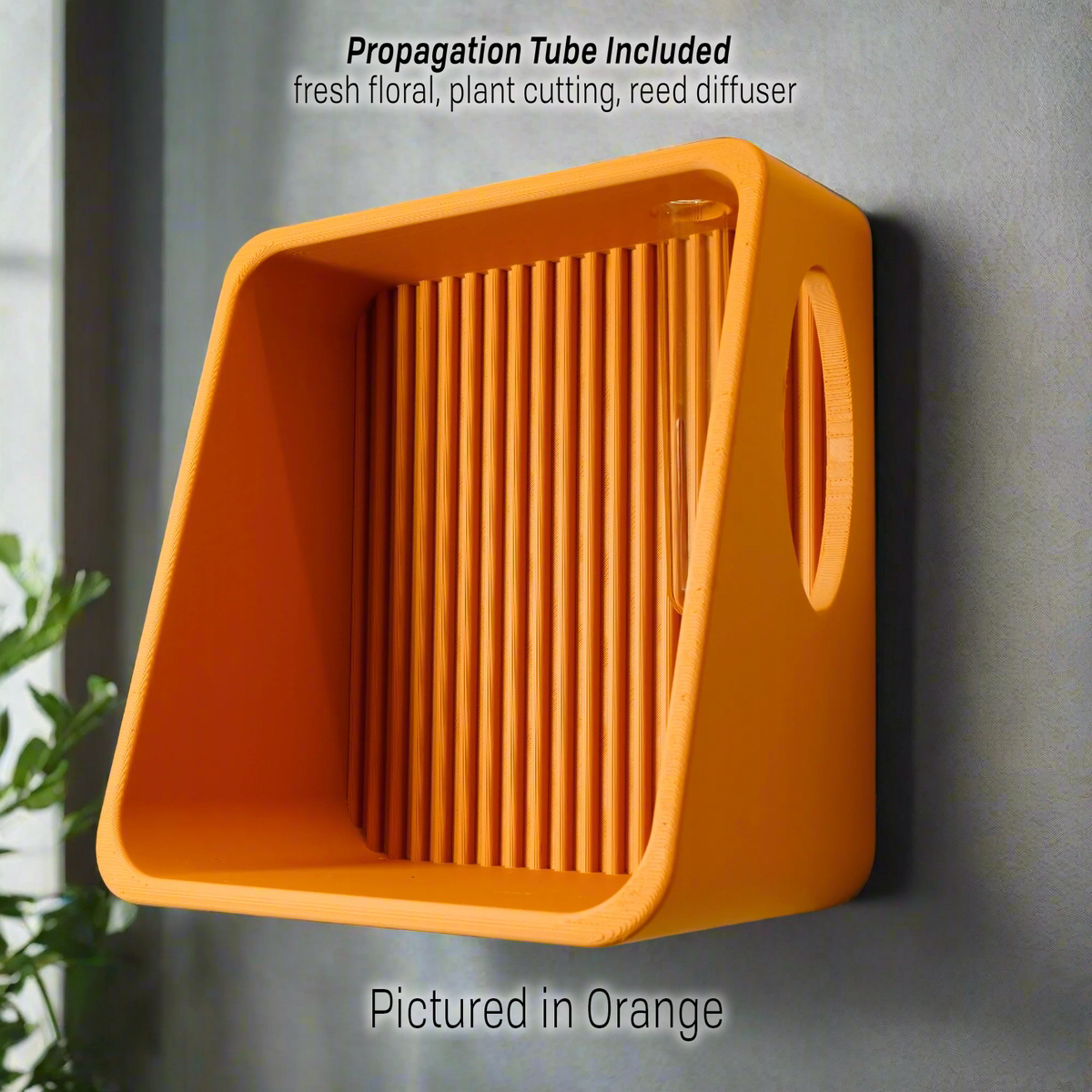 Ribbed Wall Shelf in orange with the propagation tube