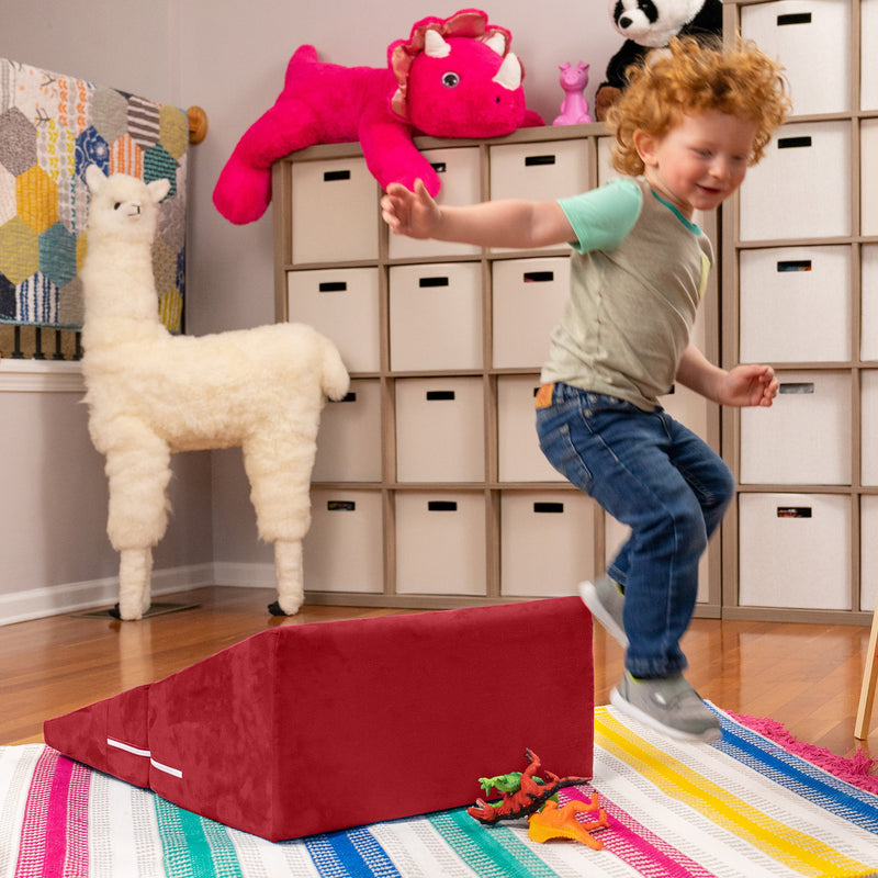 Child jumping from Playscape Flip Slide
