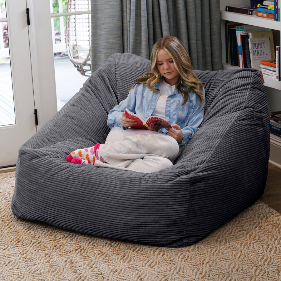 Nest Armchair by Raven-Symoné in Plush Corduroy Gray