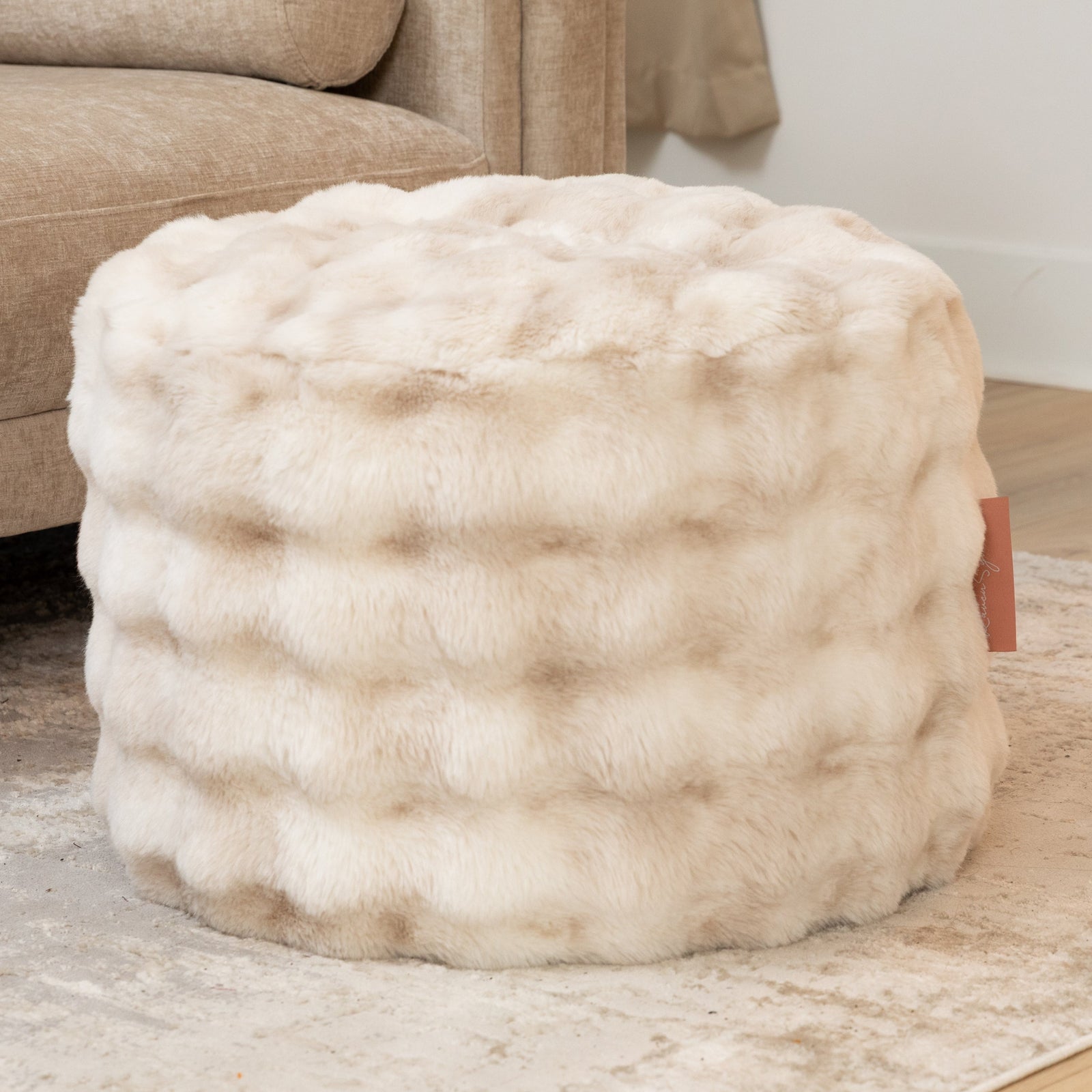Raven Round Ottoman by Raven-Symoné in Phantom Cream Faux Fur
