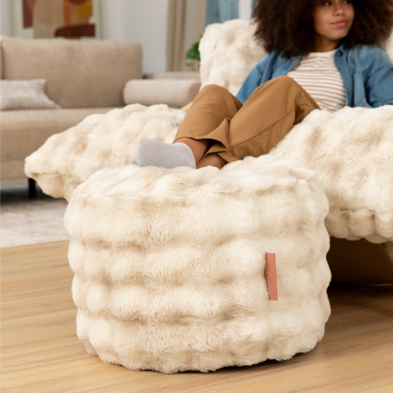 Raven Round Ottoman by Raven-Symoné in Phantom Cream Faux Fur