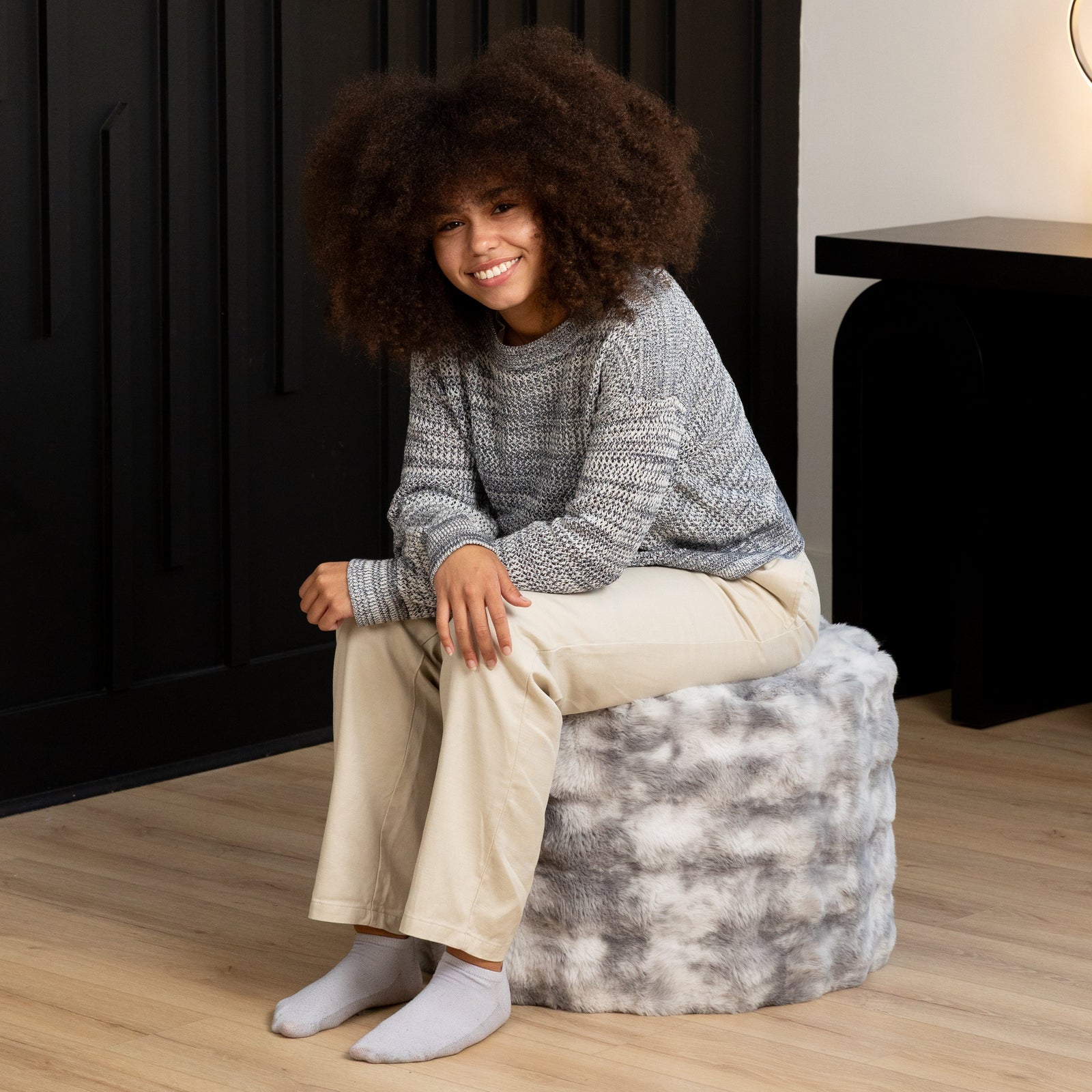 Raven Round Ottoman by Raven-Symoné in Phantom Gray Faux Fur