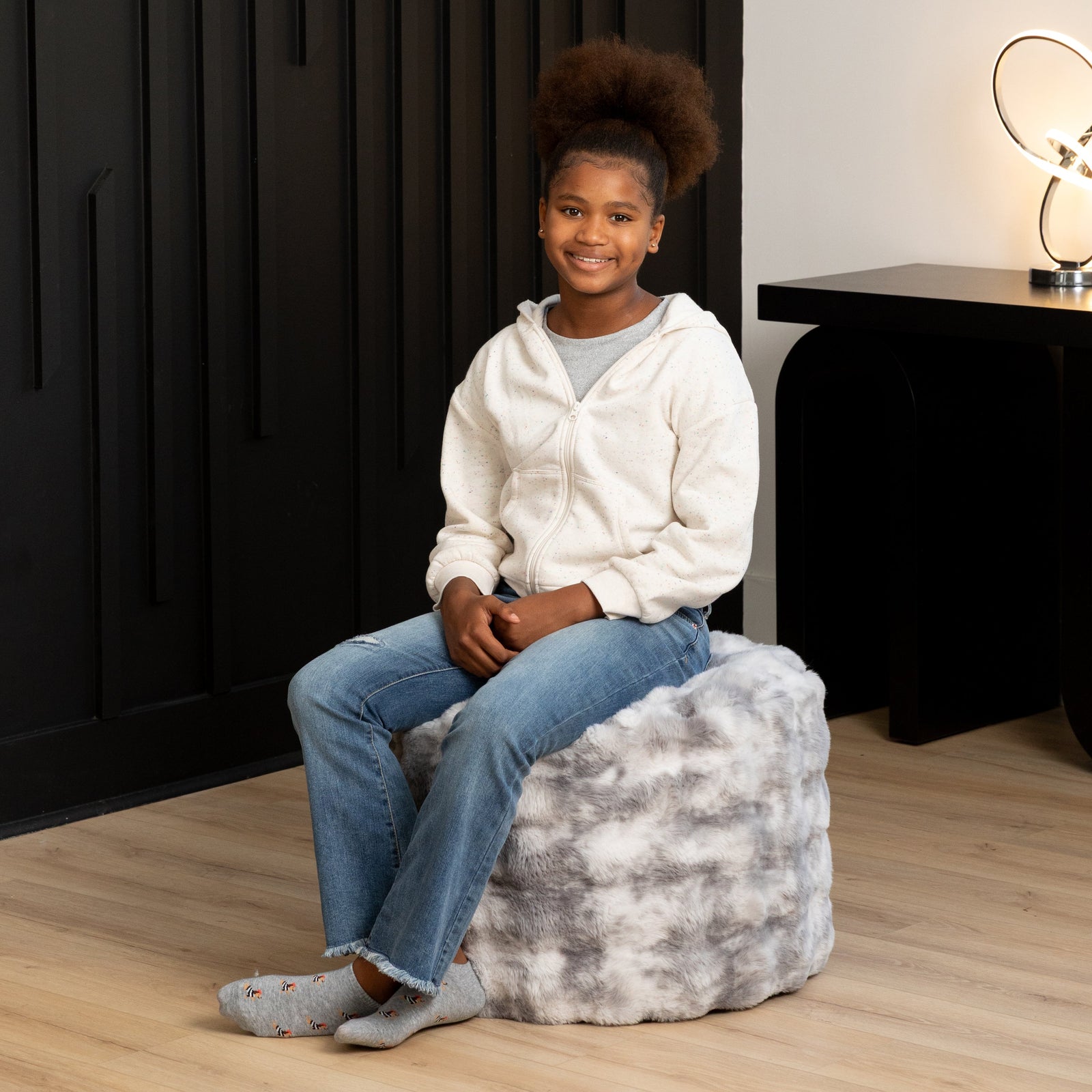 Raven Round Ottoman by Raven-Symoné in Phantom Gray Faux Fur