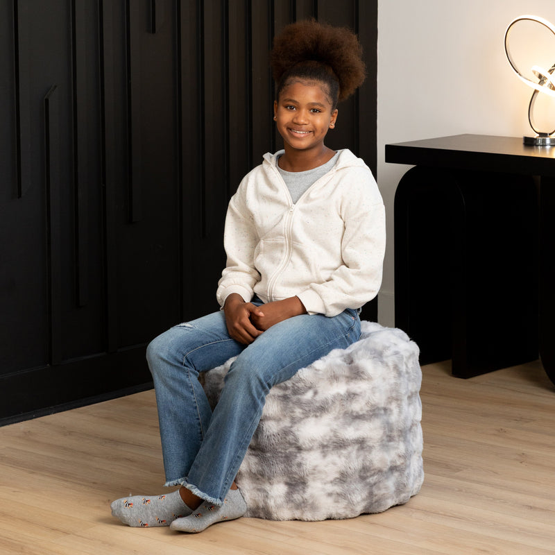 Raven Round Ottoman by Raven-Symoné in Phantom Gray Faux Fur