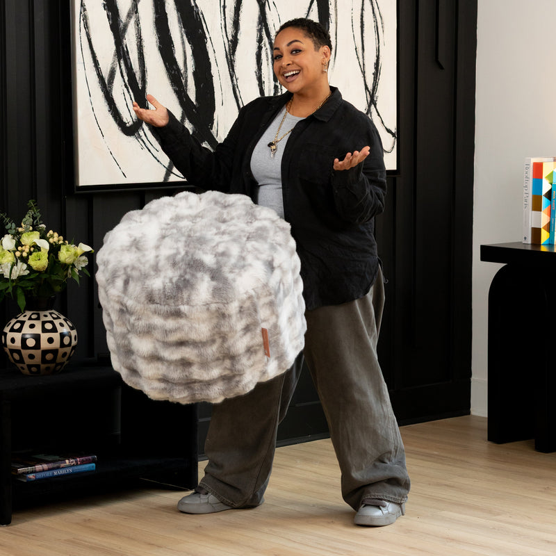 Raven Round Ottoman by Raven-Symoné in Phantom Gray Faux Fur
